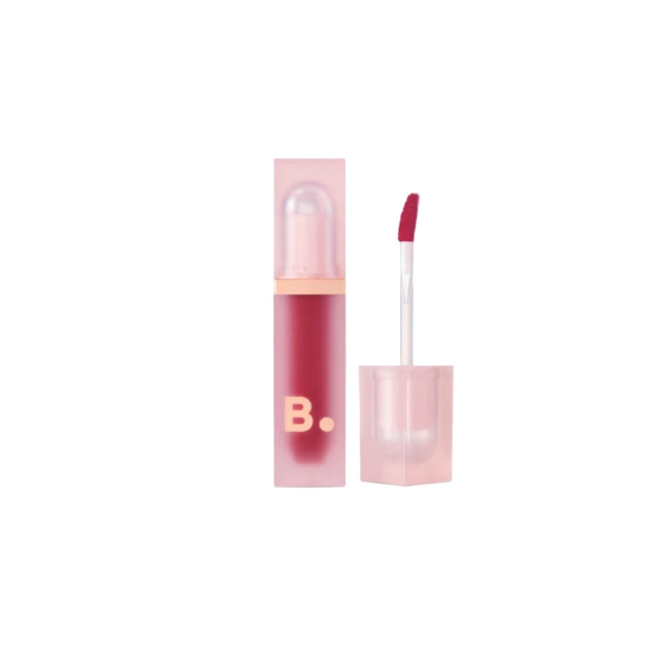 Pink lip tint with applicator and packaging on a white background