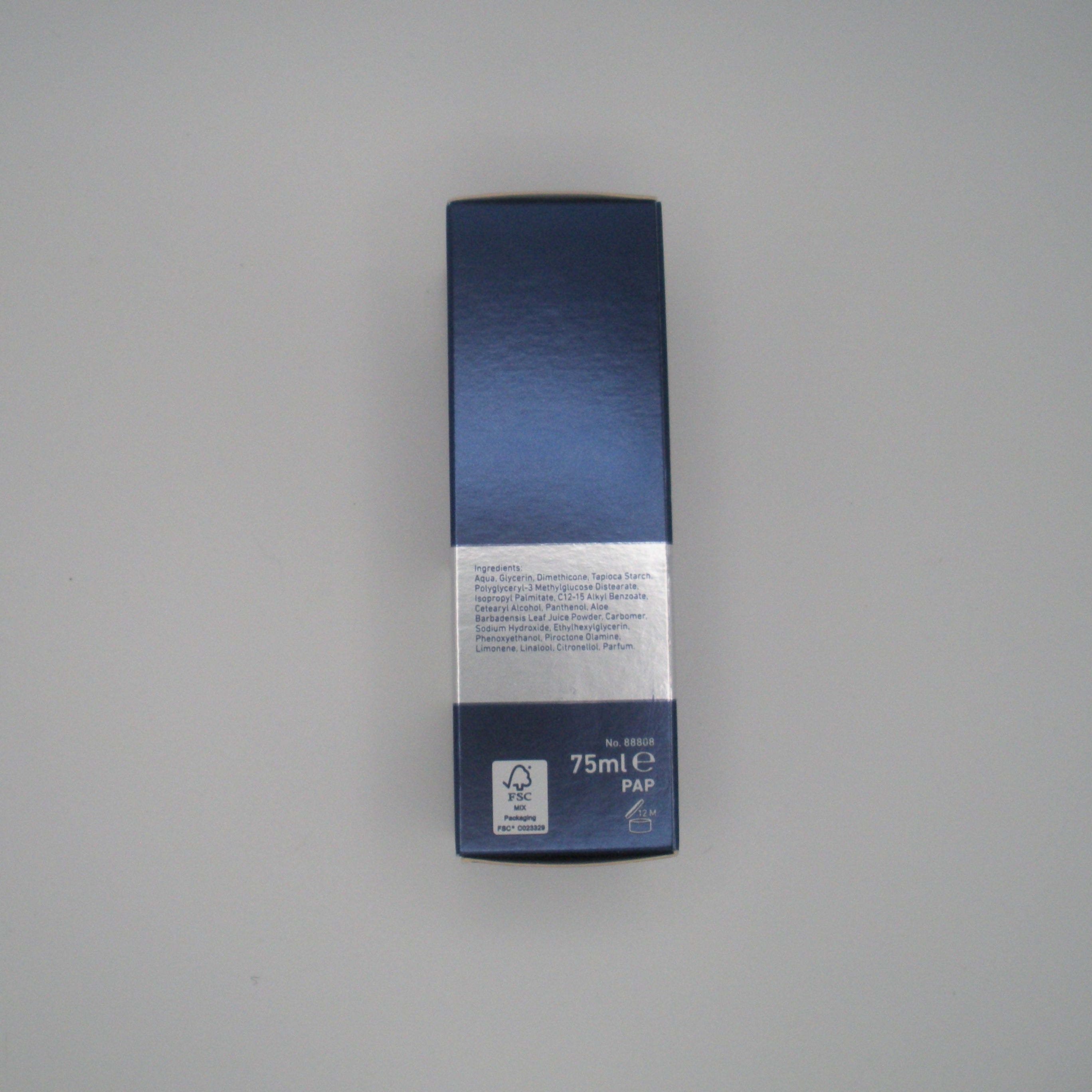 Blue and white product packaging on a gray background