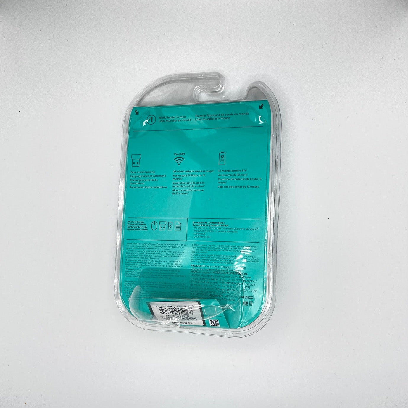 Turquoise product in clear packaging on a white background