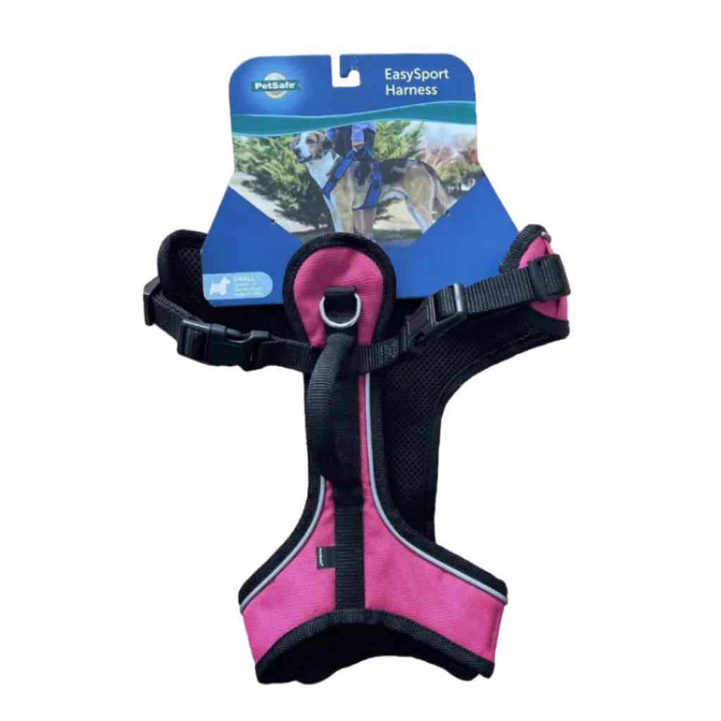 Pink dog harness with packaging on a white background